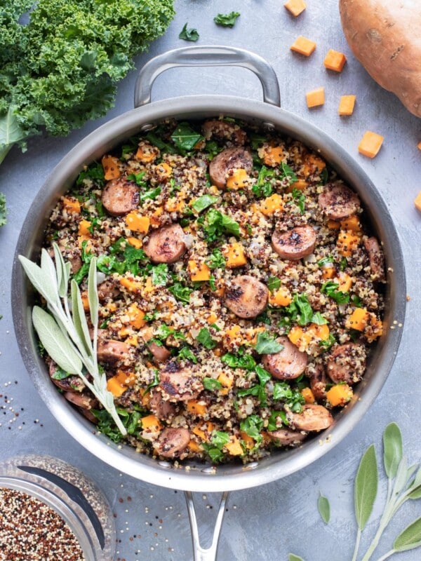 A one-pot dinner meal idea for sweet potatoes, quinoa, sausage, and kale.