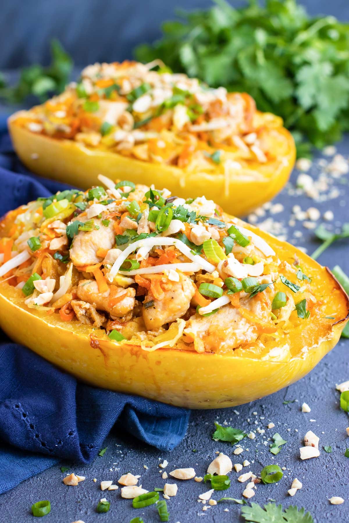 Picture of an easy stuffed spaghetti squash on a blue napkin for dinner.