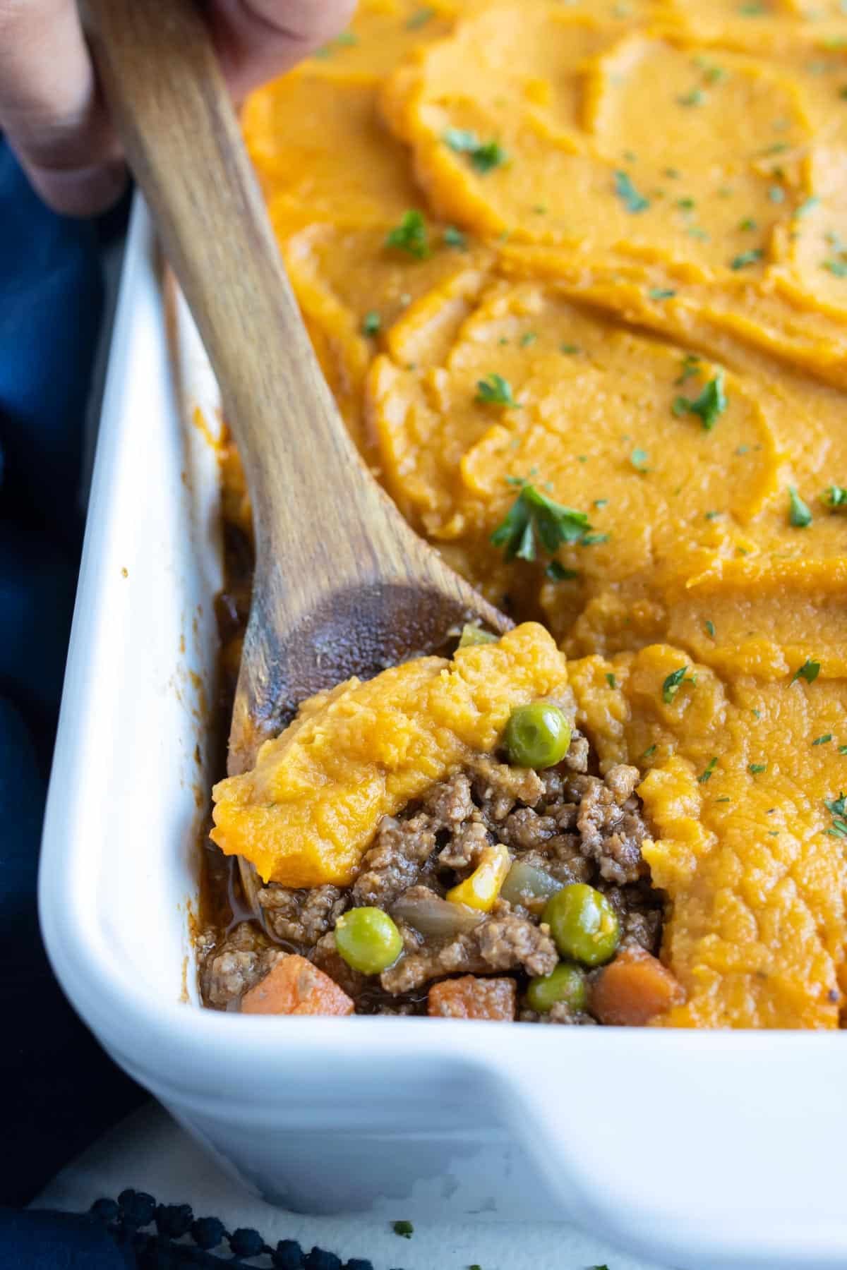 A baking dish of sweet potato shepherd's pie is served for dinner.