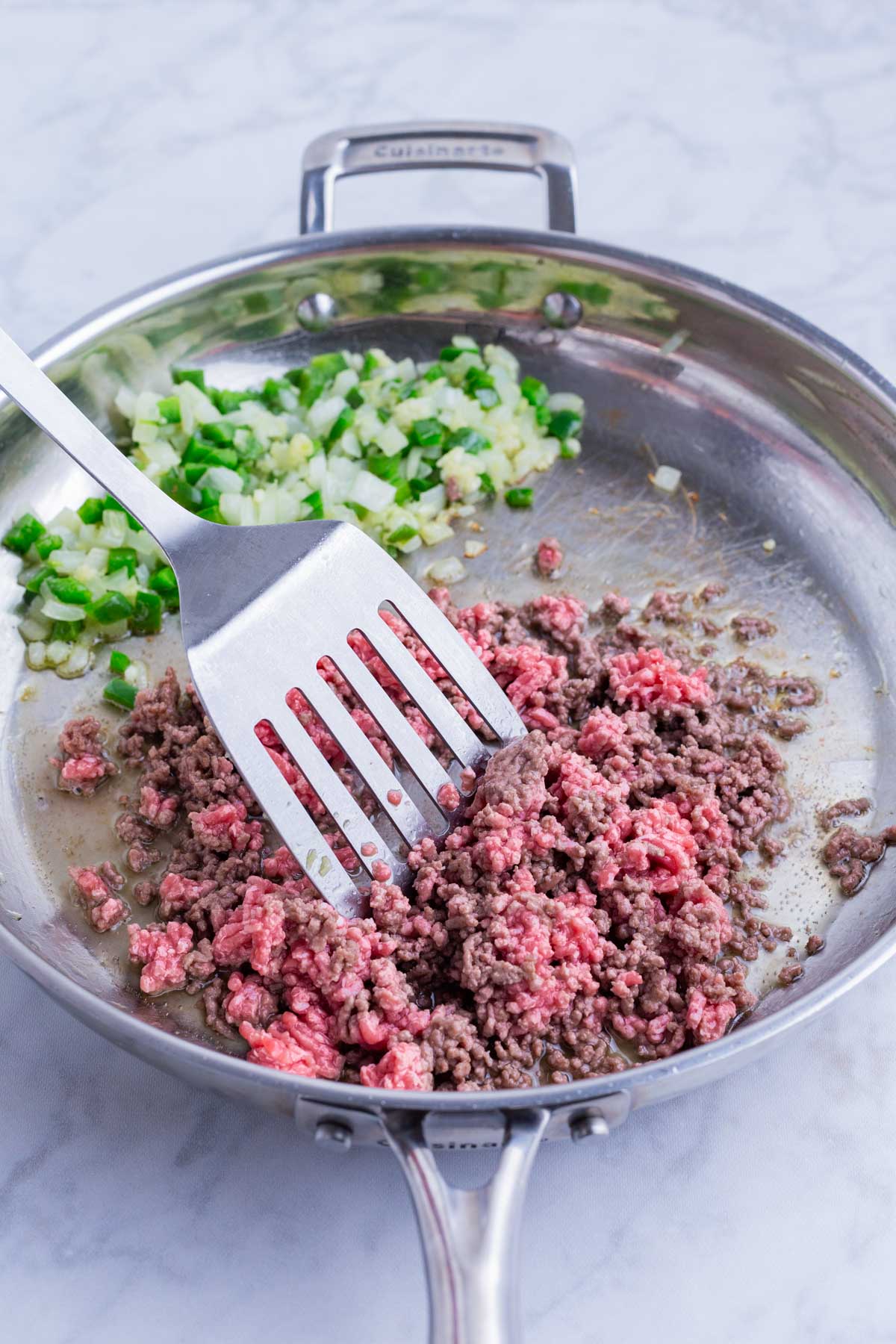 Ground beef is added to the skillet.