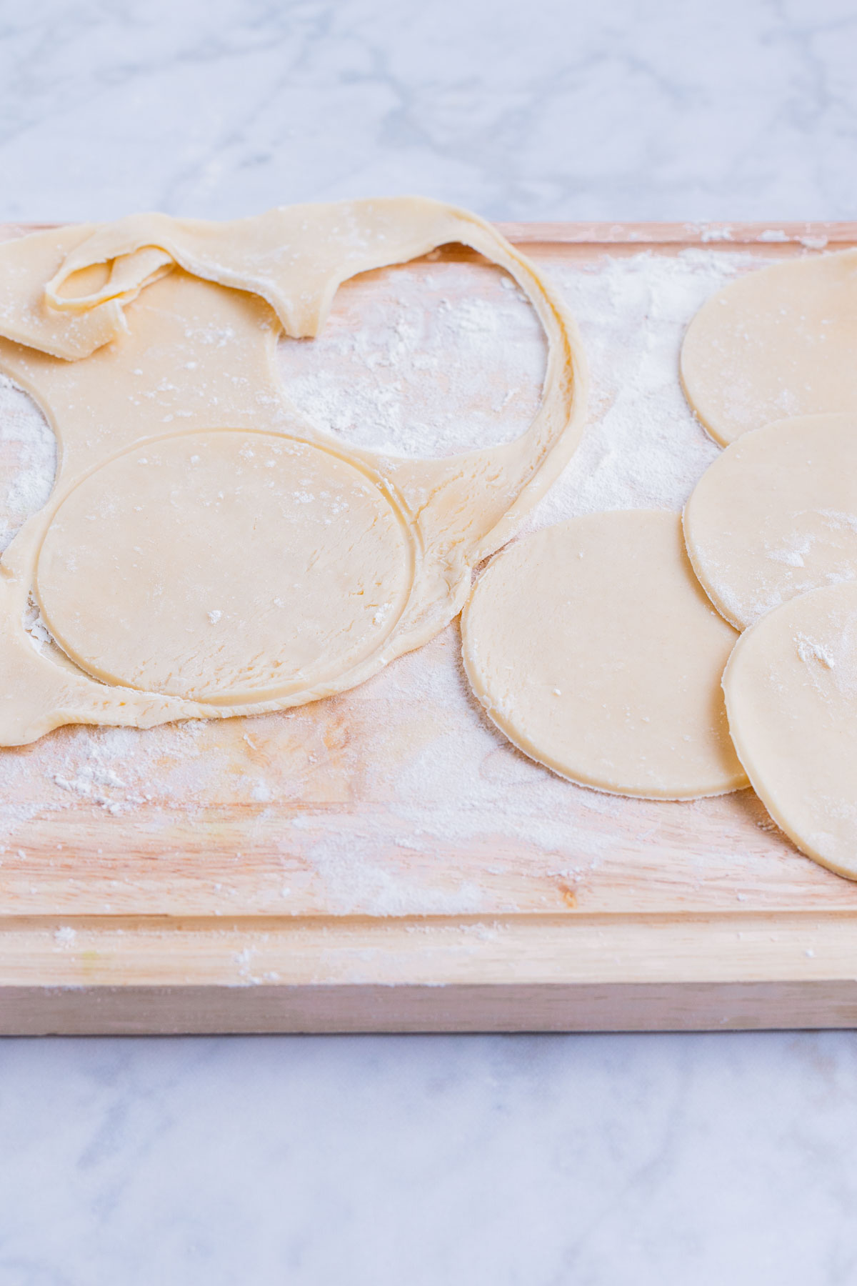 Circles are cut from the rolled out pie crust.