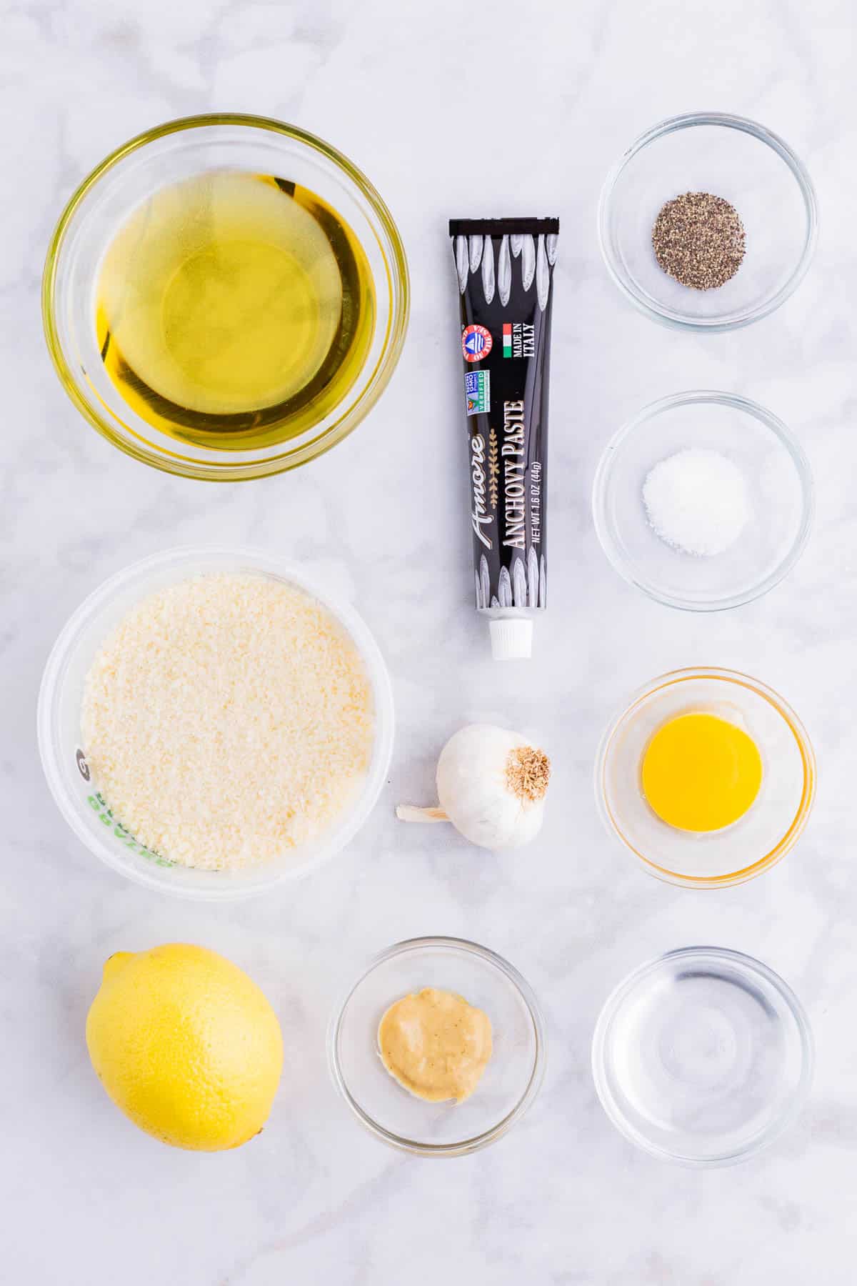 Anchovy paste, Parmesan cheese, eggs, oil, and garlic are the main ingredients for this dressing.