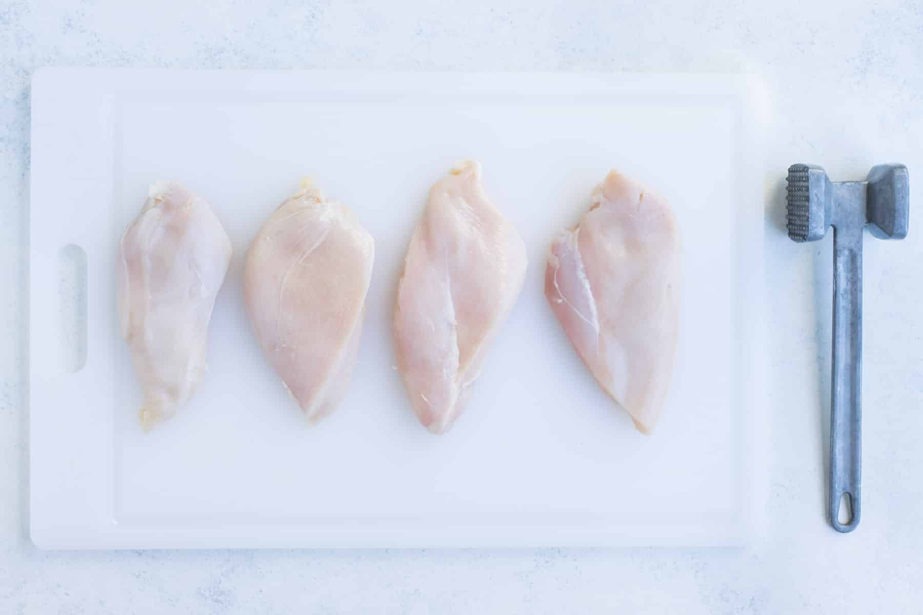 Chicken breasts are pounded into 1 inch thick.