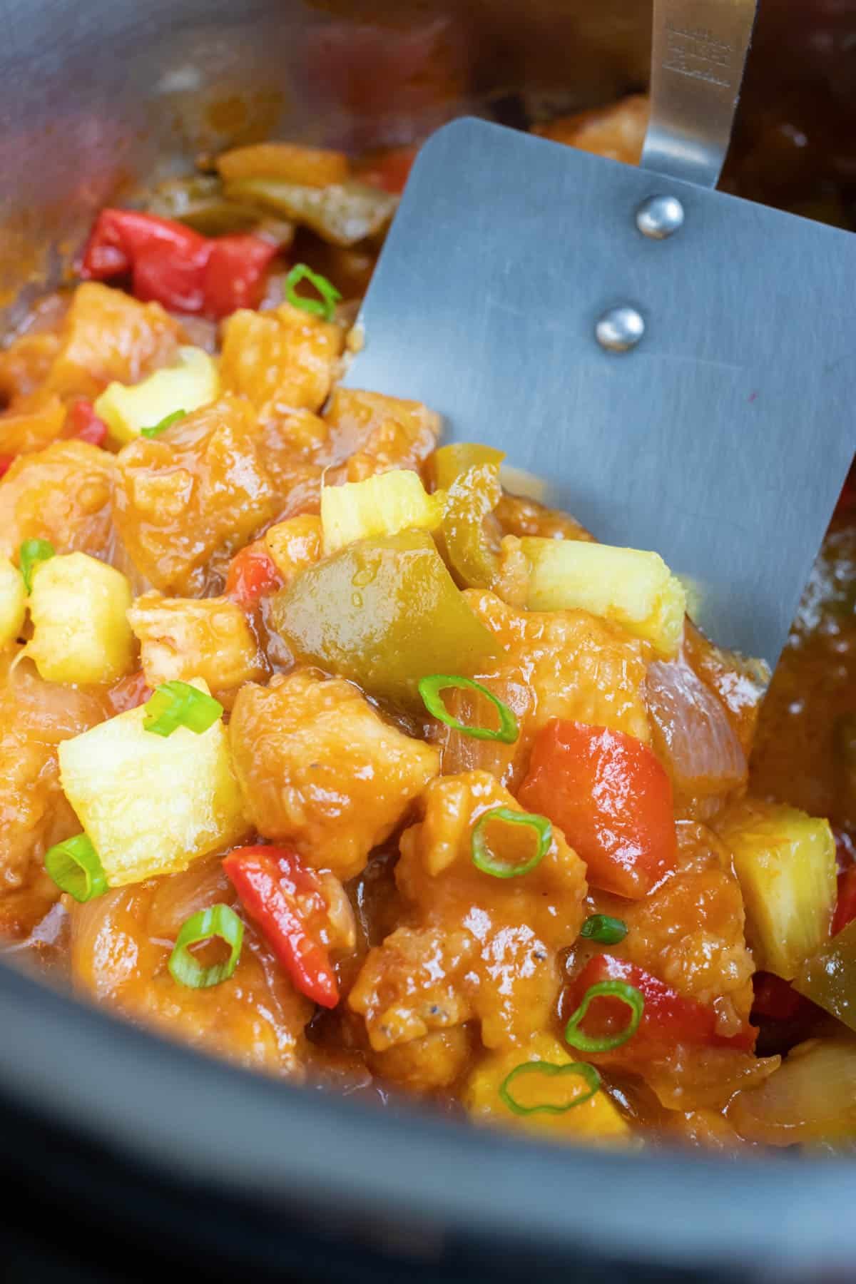 Pineapple, bell peppers, and chicken are mixed together for this healthy Hawaiian chicken recipe.