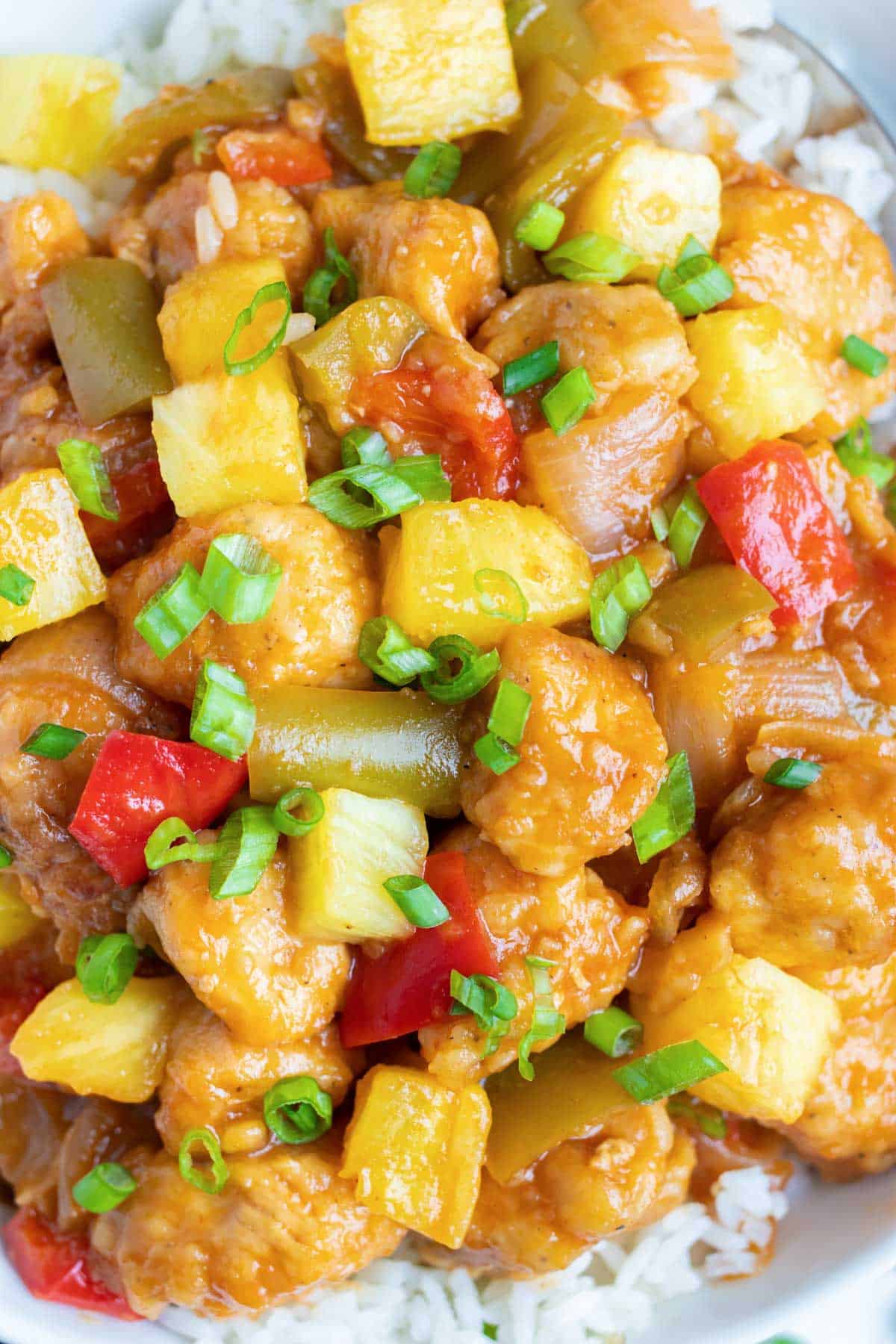 Tender chicken, cubed pineapple, and chopped bell peppers are served over rice in this quick and easy pressure cooker recipe.