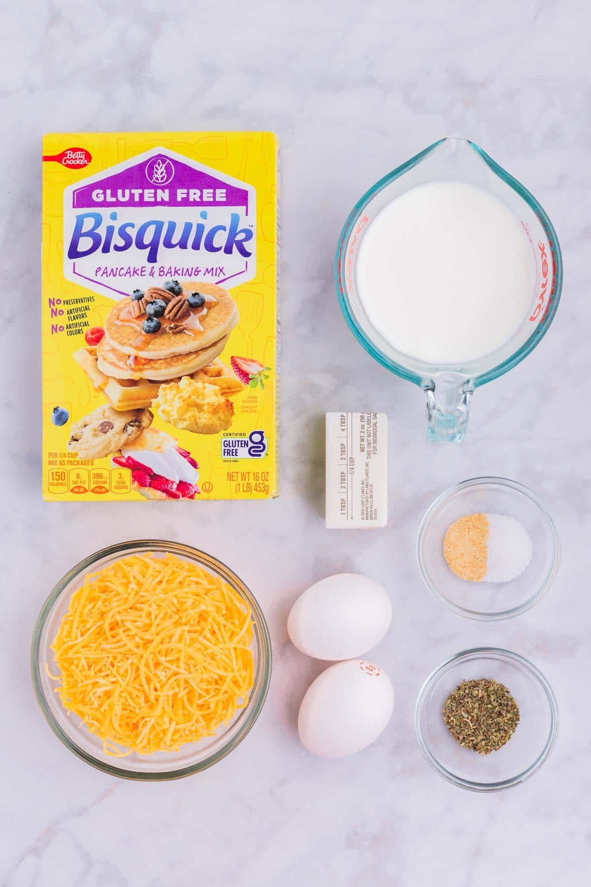Bisquick, cheddar cheese, milk, butter, eggs, and seasonings are the ingredients to this dish.