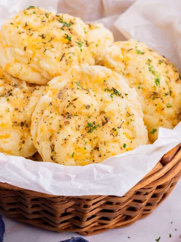 A basket of cheddar bay biscuits are served.