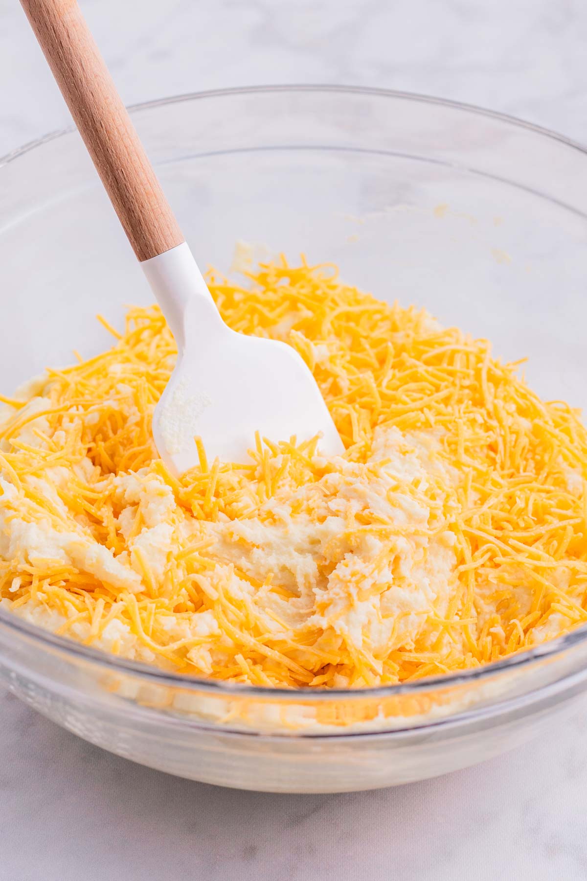 Cheese is stirred into the batter.