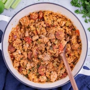 A Dutch oven full of a sausage Jambalaya recipe for a Cajun Mardi Gras party.