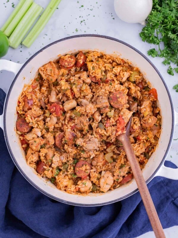 A Dutch oven full of a sausage Jambalaya recipe for a Cajun Mardi Gras party.