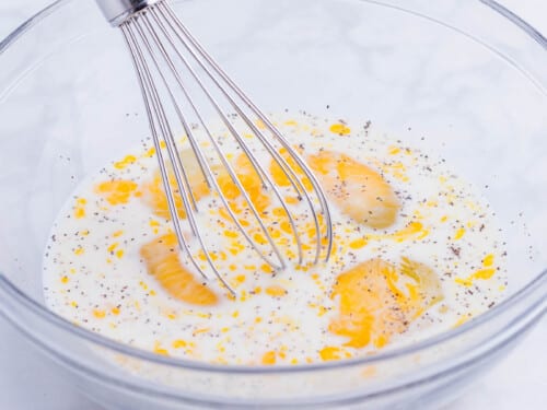 The batter ingredients are whisked together.