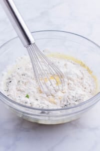 The batter ingredients are whisked together.