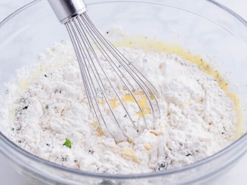 The batter ingredients are whisked together.