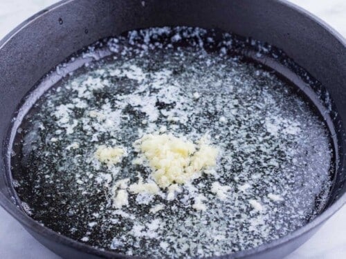 Garlic is added to the hot butter.