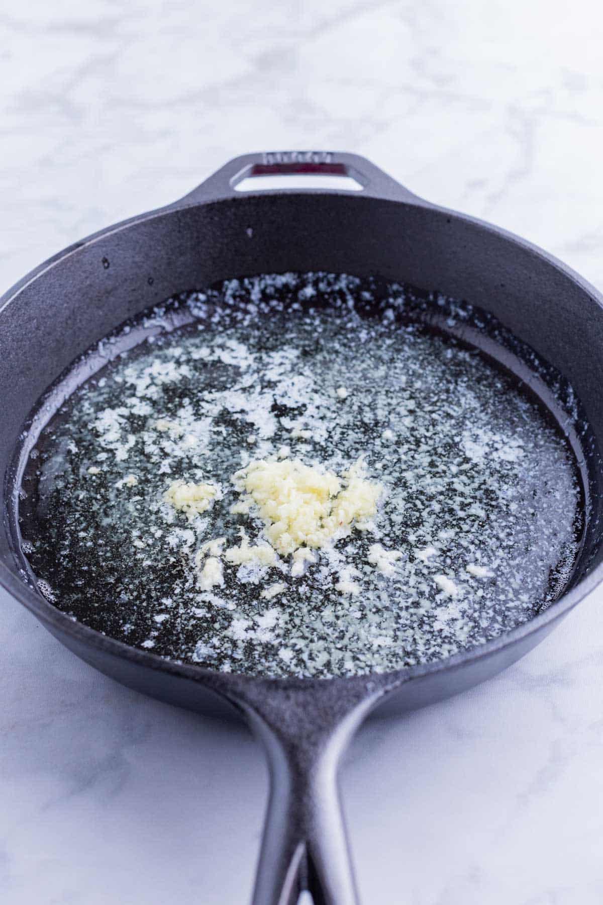 Garlic is added to the hot butter.