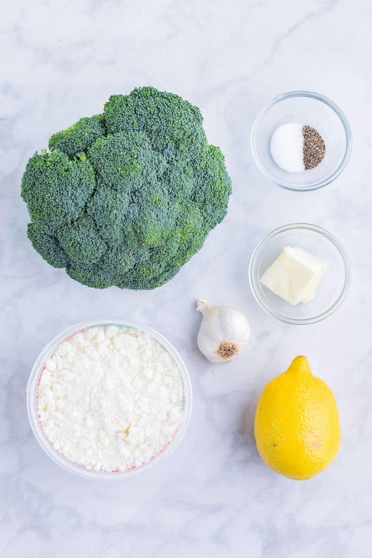 Broccoli, lemon, salt, pepper, garlic, butter, and Parmesan cheese are the ingredients for this dish.