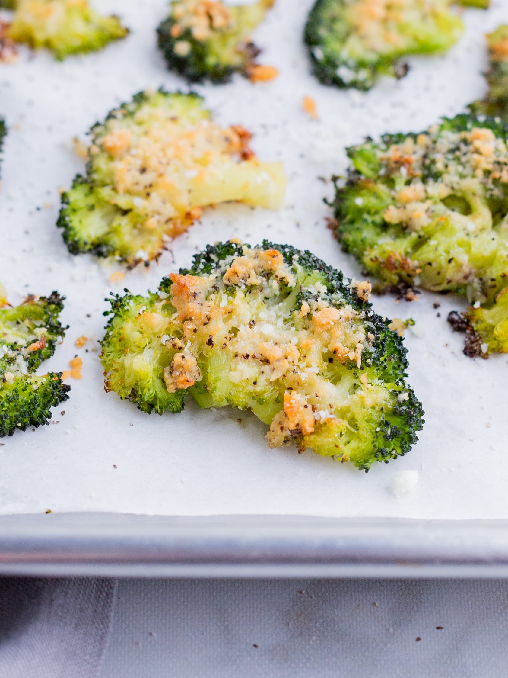 Smashed broccoli is baked in the oven until crispy.