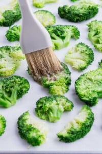 The butter mixture is spread over the top of the smashed broccoli.