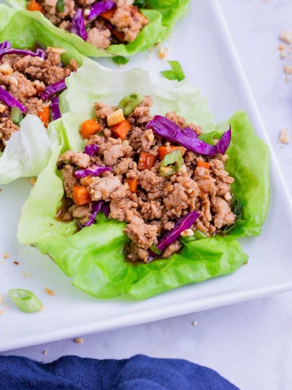 Thai-flavored chicken is served inside a lettuce leaf for a low carb meal.
