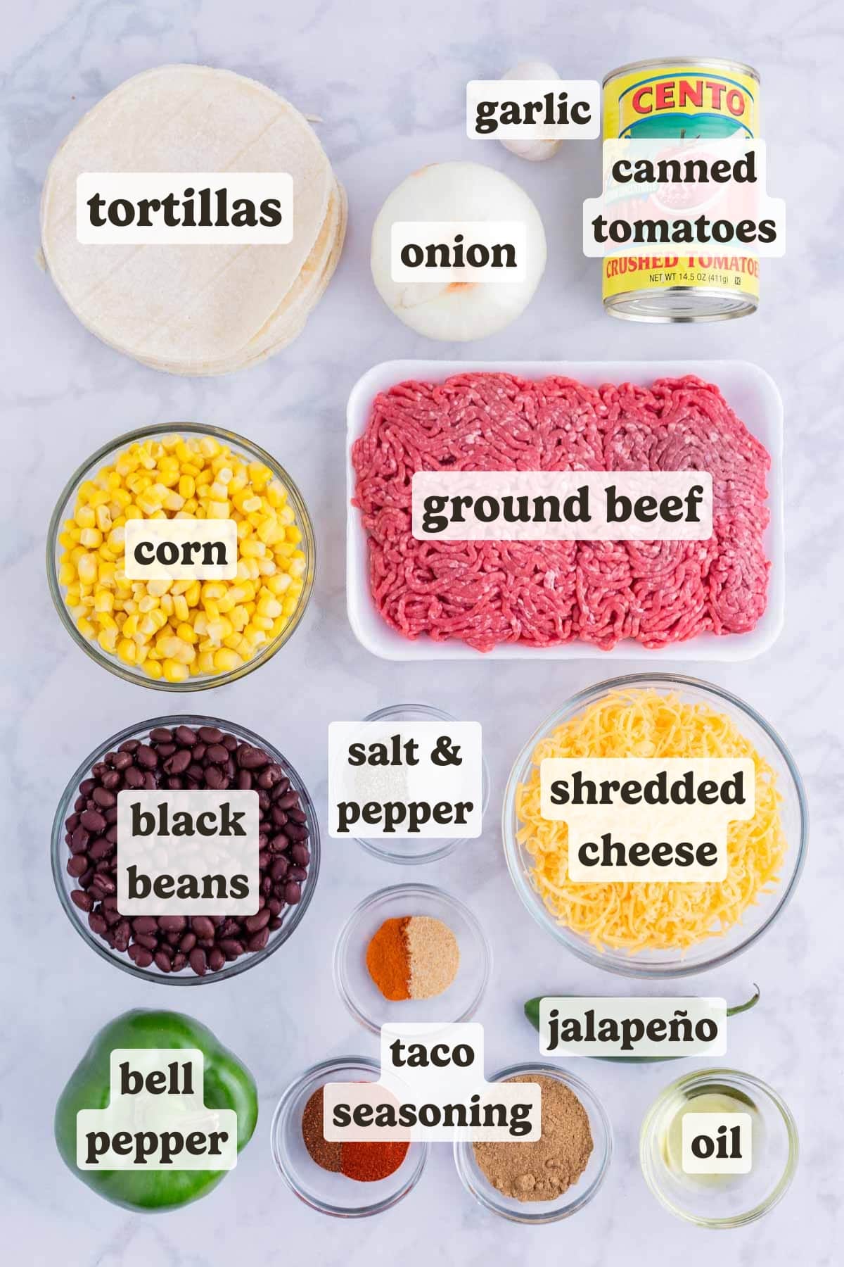 Ground beef, black beans, corn, cheese, corn tortillas, veggies, and taco seasoning are the main ingredients for this Mexican Lasagna dish.