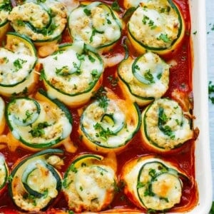 Healthy Zucchini Lasagna Roll-Ups in a white dish for dinner.