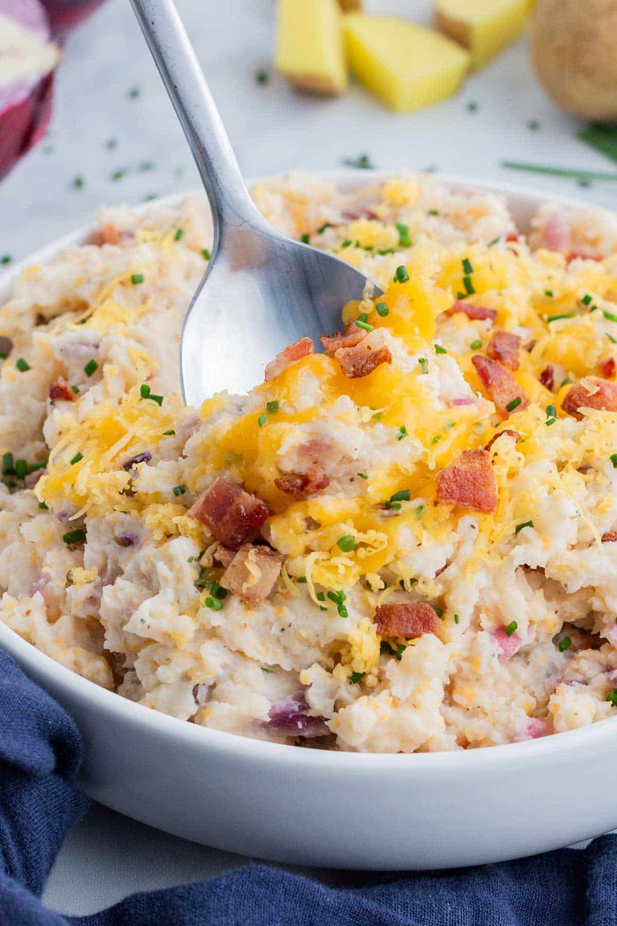 Cheese is stirred into the mashed potatoes.