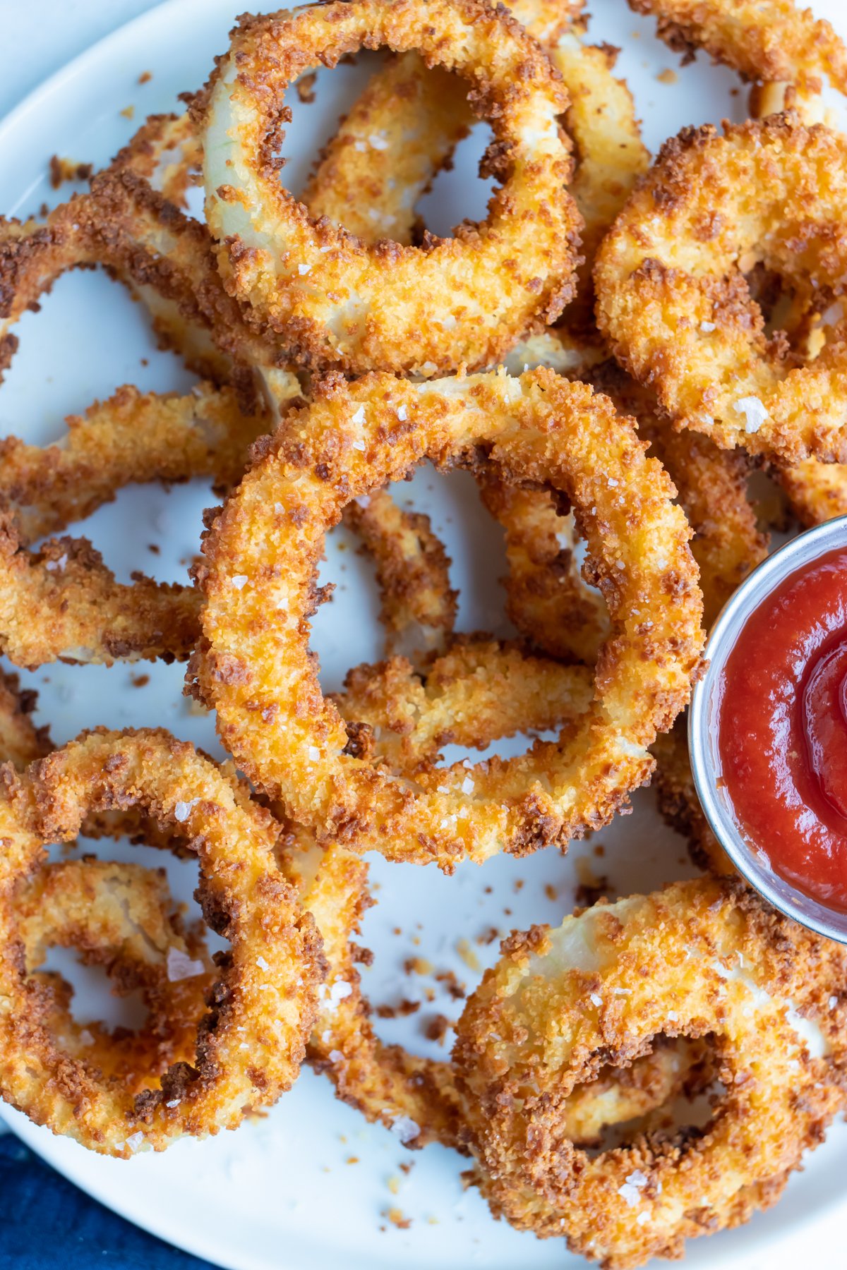 Onion rings are cooked in the air fryer until perfectly crispy and golden brown.