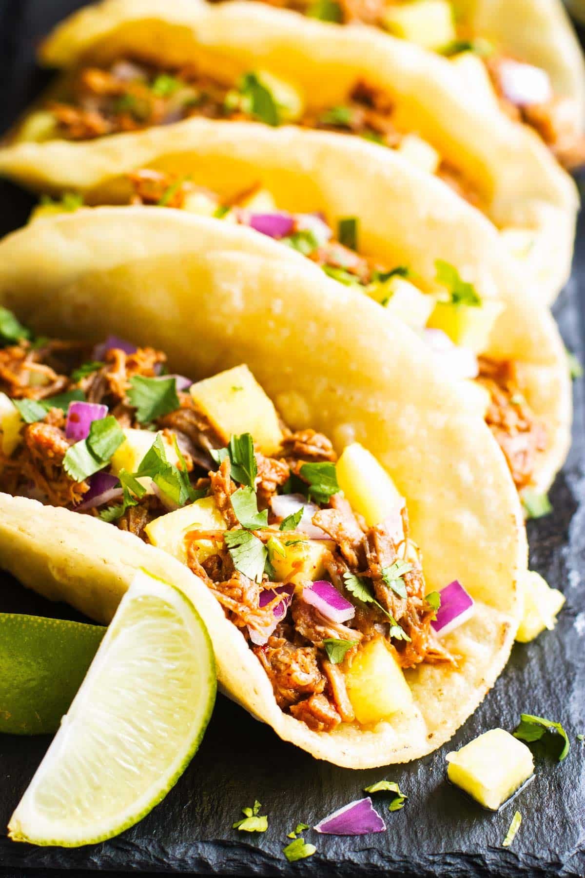 Instant Pot Tacos al Pastor recipe on a slate for a healthy dinner.
