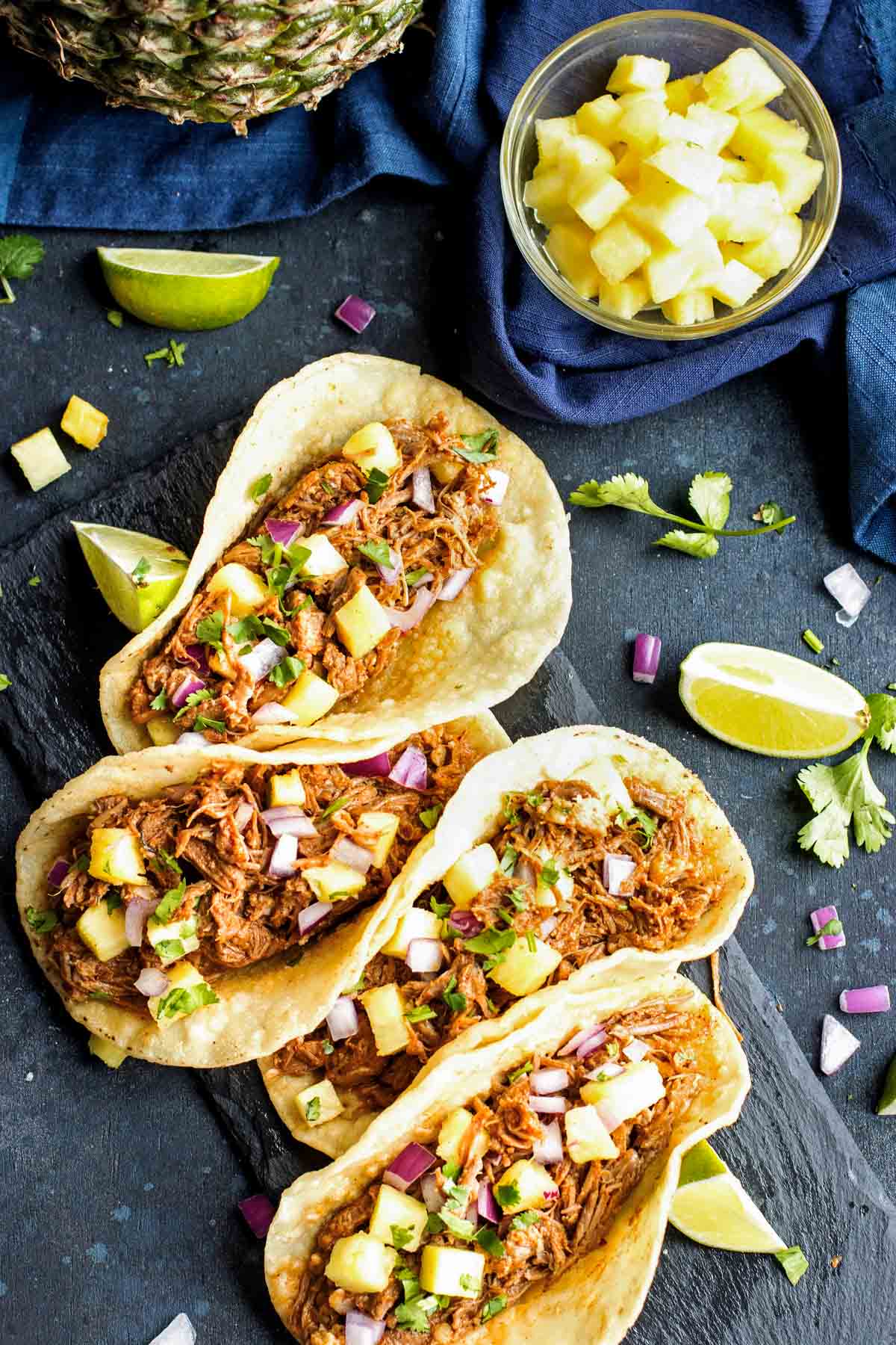 An overhead picture of gluten-free al pastor on a slate.