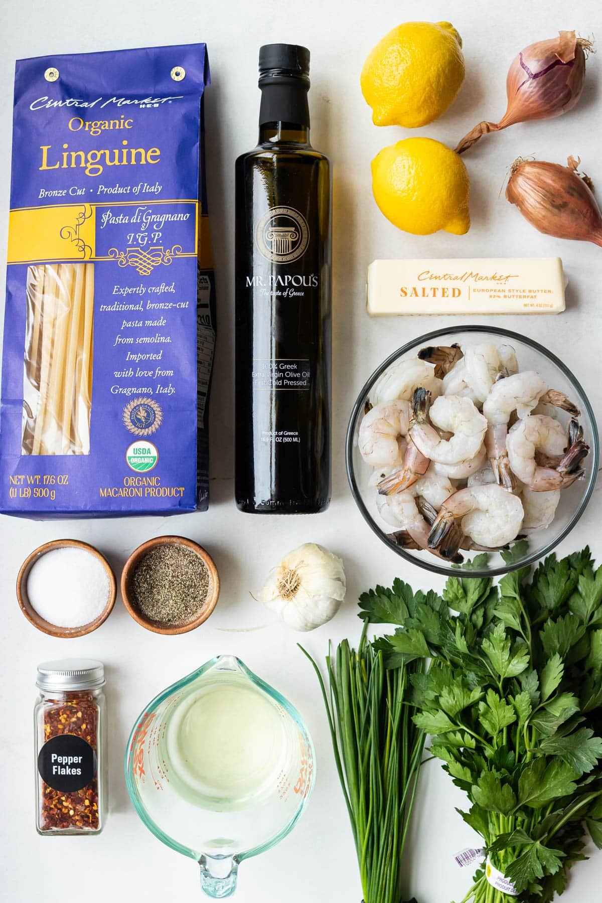 Shrimp, linguine, butter, white wine, olive oil, lemons and parsley are the ingredients for this shrimp scampi linguine recipe.