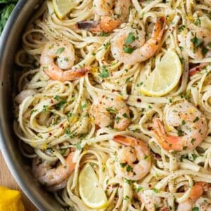 Shrimp scampi linguine with a lemon garlic butter sauce is served in a skillet in under 30 minutes.