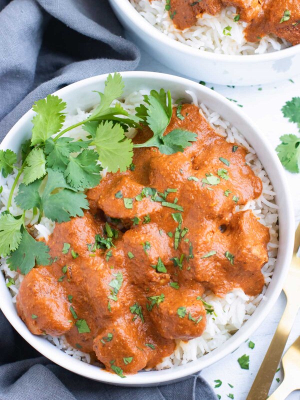 Overhead picture of Easy Slow Cooker Chicken Tikka Masala in a white bowl.