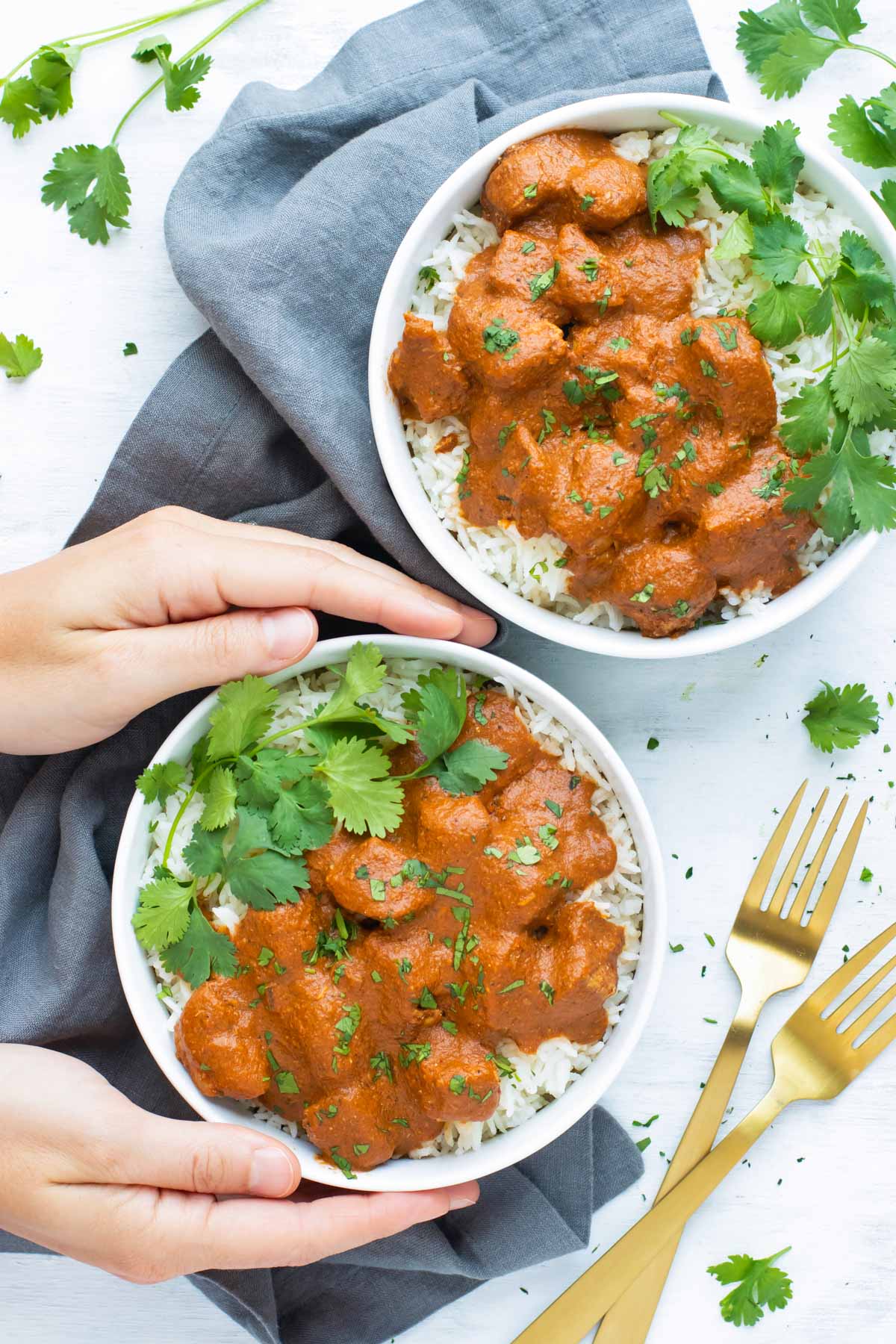 Overhead picture of Chicken Tikka Masala recipe with rice in a white bowl.