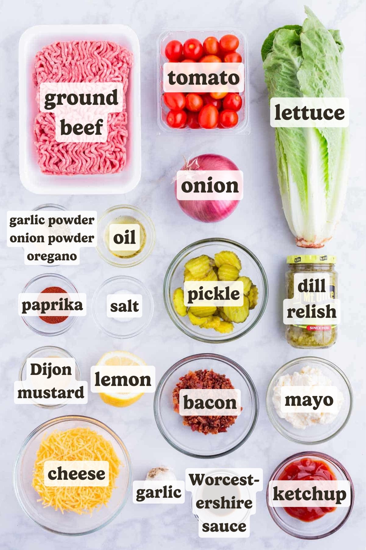 Ground beef, seasonings, lettuce, pickles, onion, tomato, and bacon are the main ingredients for this burger in a bowl recipe.