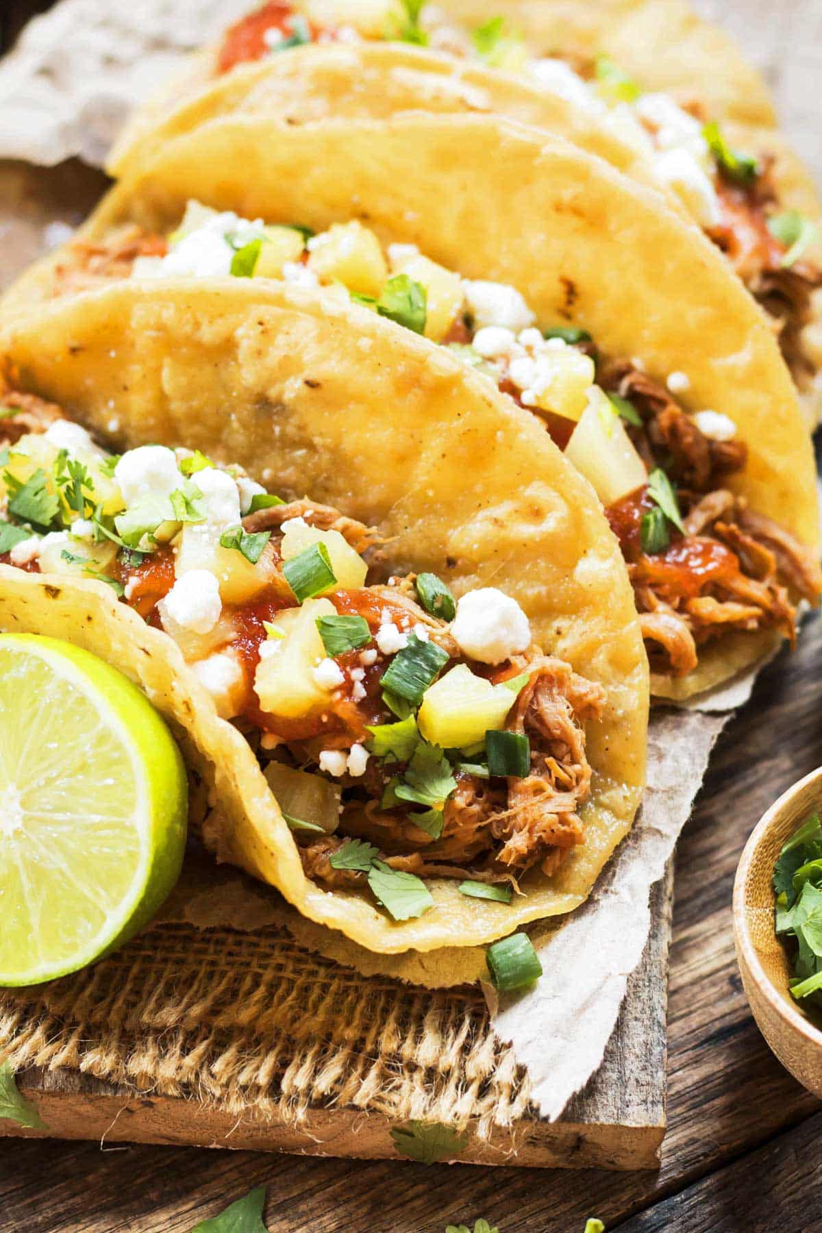 Gluten-free Pineapple Pulled Pork Tacos made in the slow cooker ready to serve for dinner.