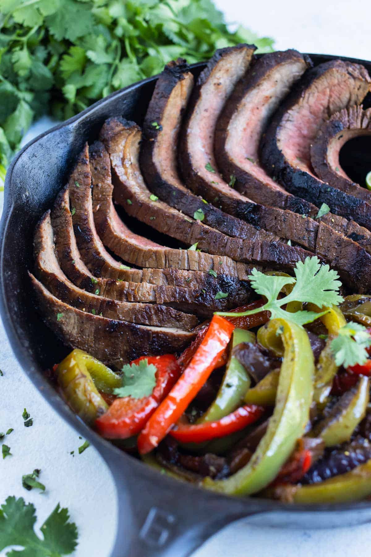 Fajitas are made in a cast iron skillet for a quick meal.