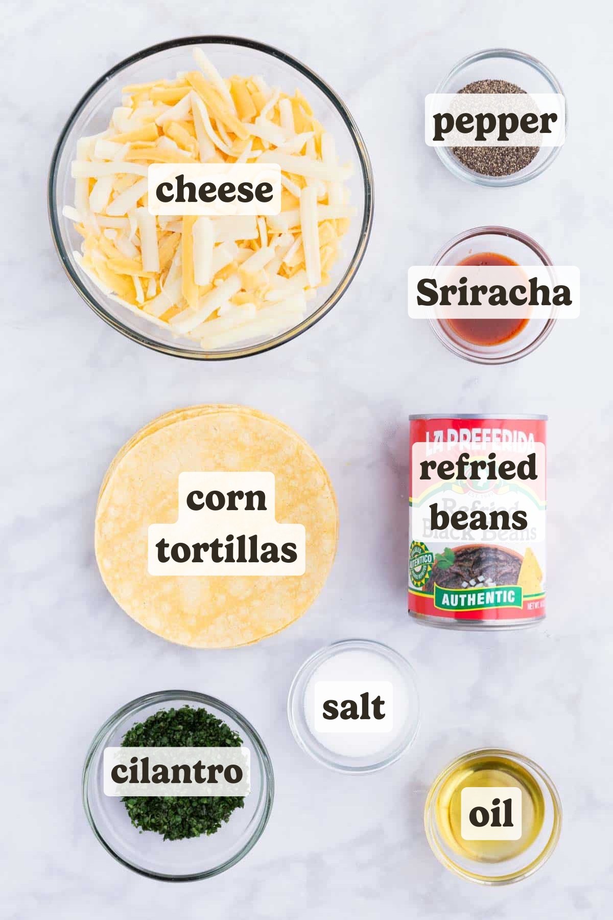 Corn tortillas, cheese, black beans, and seasonings are the main ingredients for this quesadilla dish.