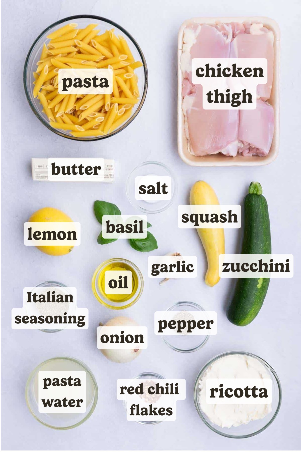 Chicken thighs, pasta, zucchini, squash, onion, lemon, and ricotta are the main ingredients for this dish.