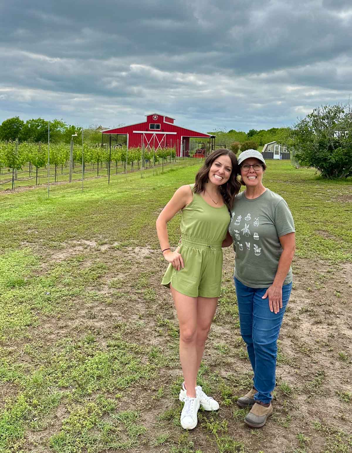 London and her Mom on the San Marcos farm with grapes, chickens, peach and pecan trees.