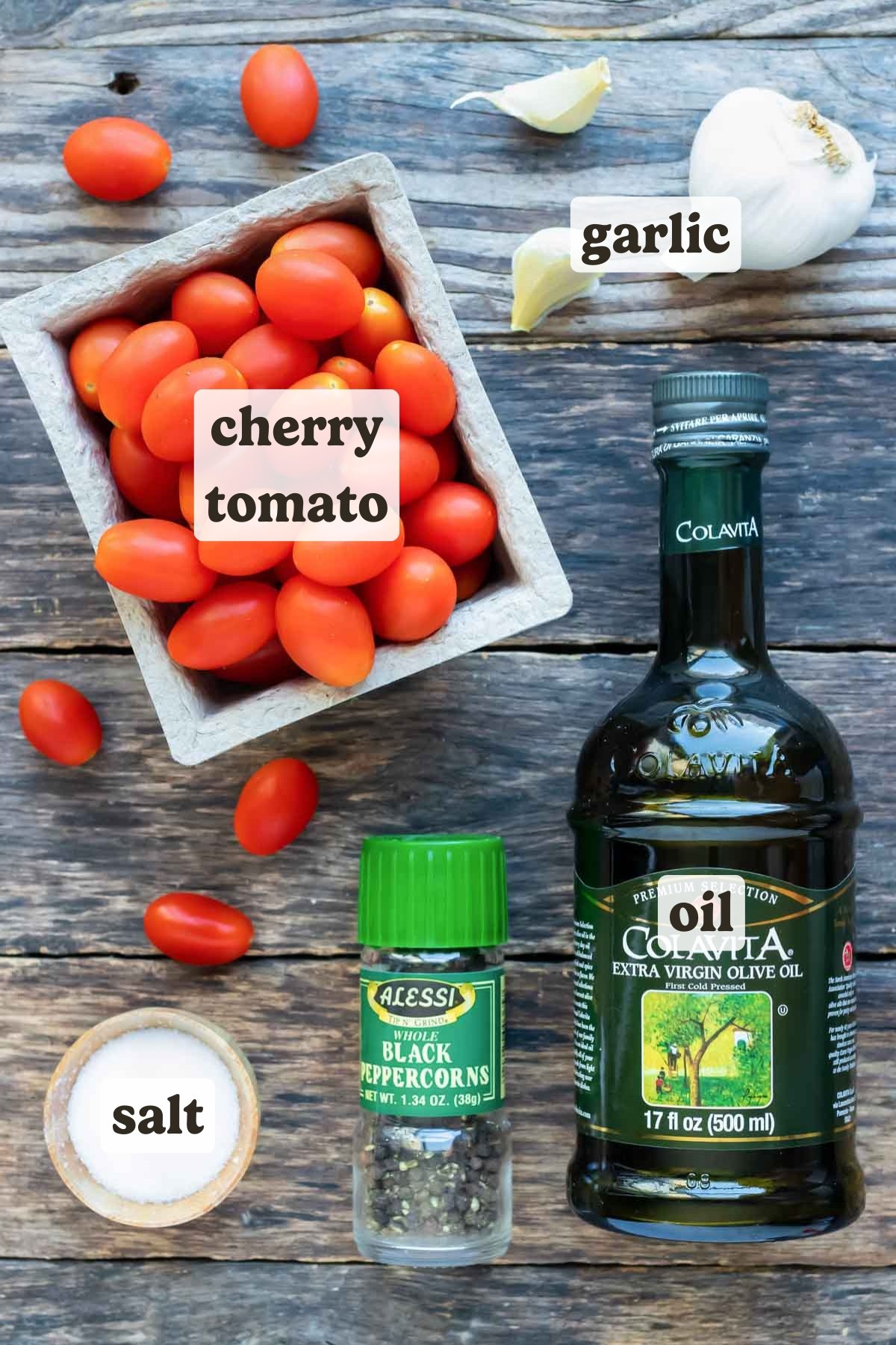 Cherry and grape tomatoes, olive oil, cracked black pepper, sea salt, and garlic as the ingredients for a roasted tomatoes recipe.