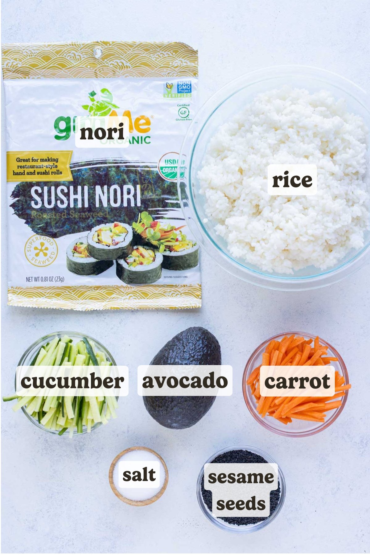 Avocado, carrots, cucumbers, sushi rice, nori, sesame seeds, and salt are the ingredients for this recipe.