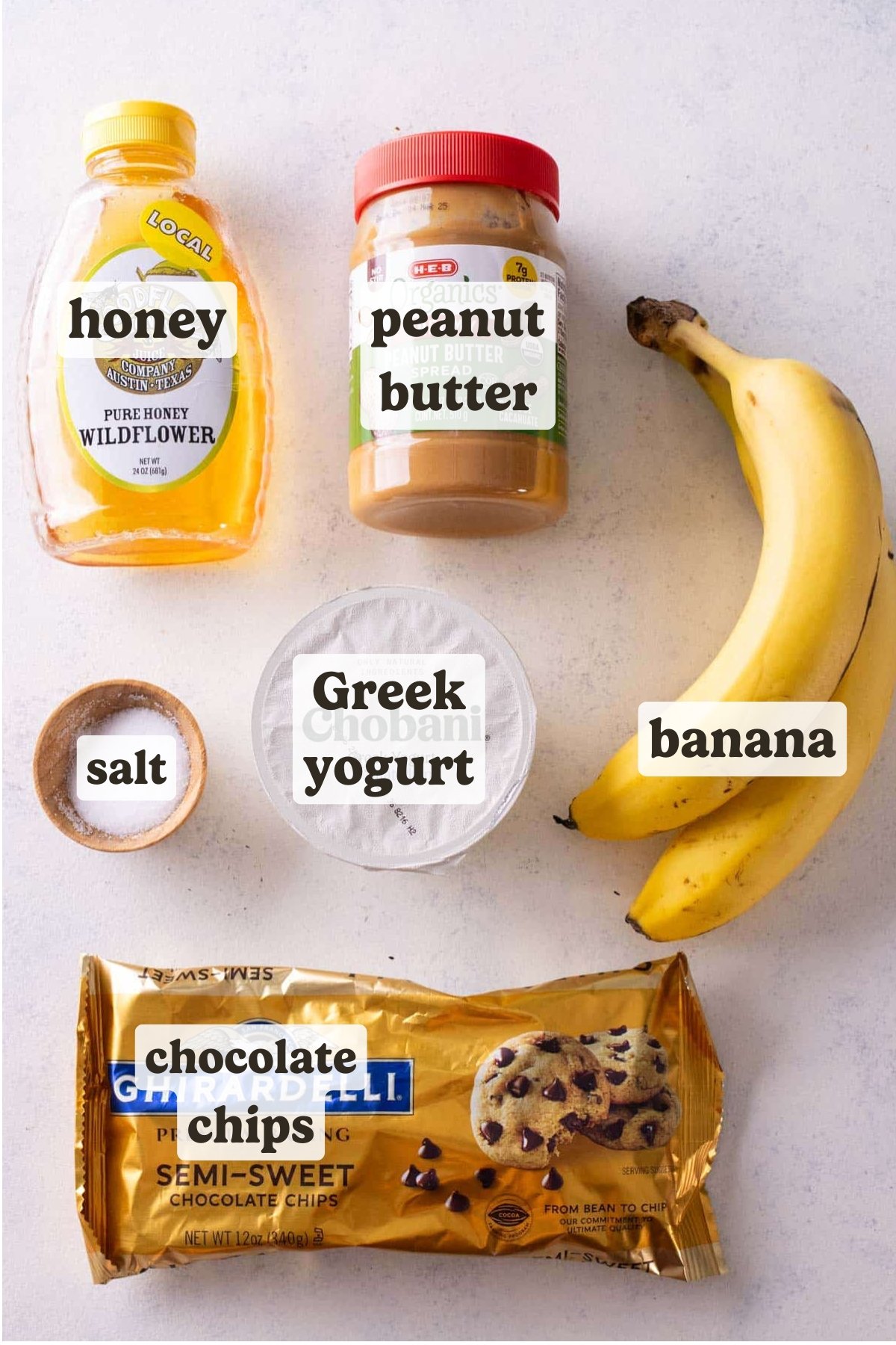 Greek yogurt, peanut butter, honey, bananas, and chocolate chips are the main ingredients for this chunky monkey frozen yogurt bark recipe.