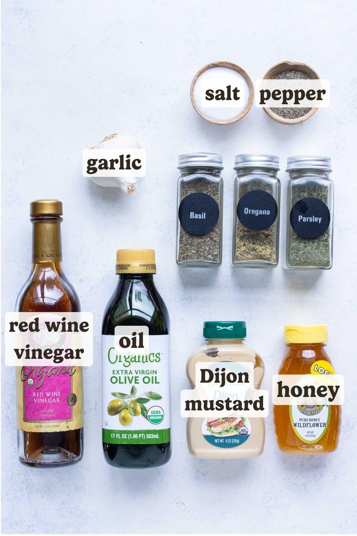 Honey, vinaigrette, olive oil, garlic, dijon mustard, basil, oregano, parsley, salt, and pepper are the ingredients for Greek Salad Dressing.