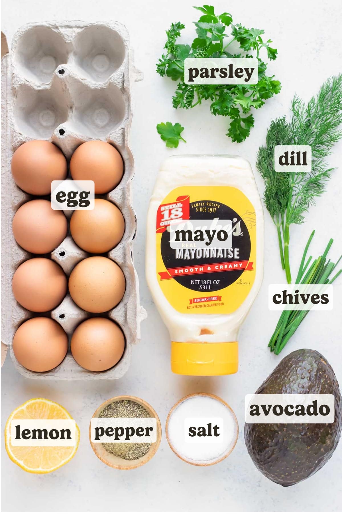 Hard-boiled eggs, fresh herbs, avocado, mustard, salt, pepper, and mayonnaise are the ingredients for this recipe.
