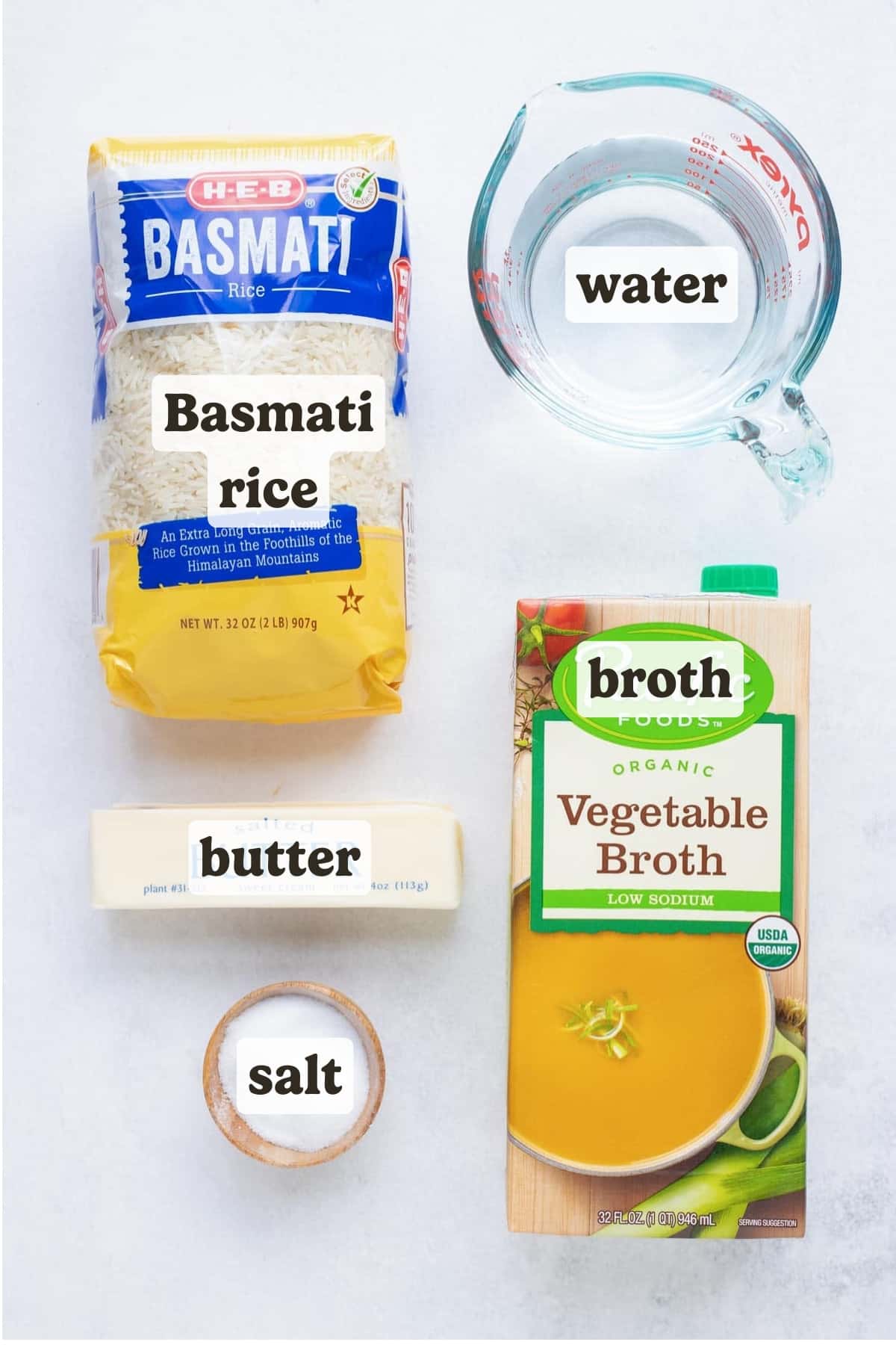 The ingredients for instant pot basmati rice are arranged on a white countertop.