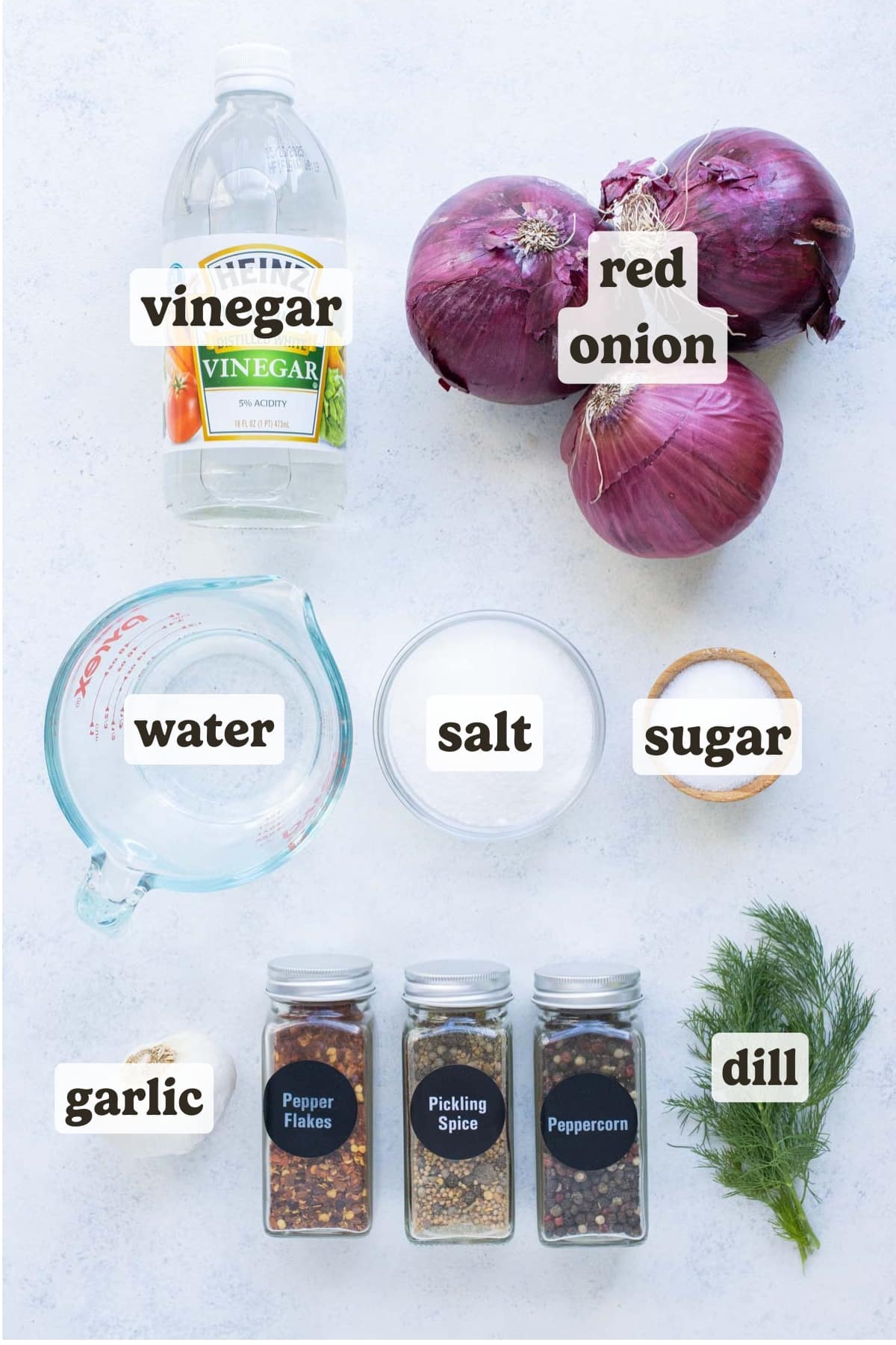 Red onions, vinegar, salt, sugar, and herbs are the ingredients for pickled red onions.