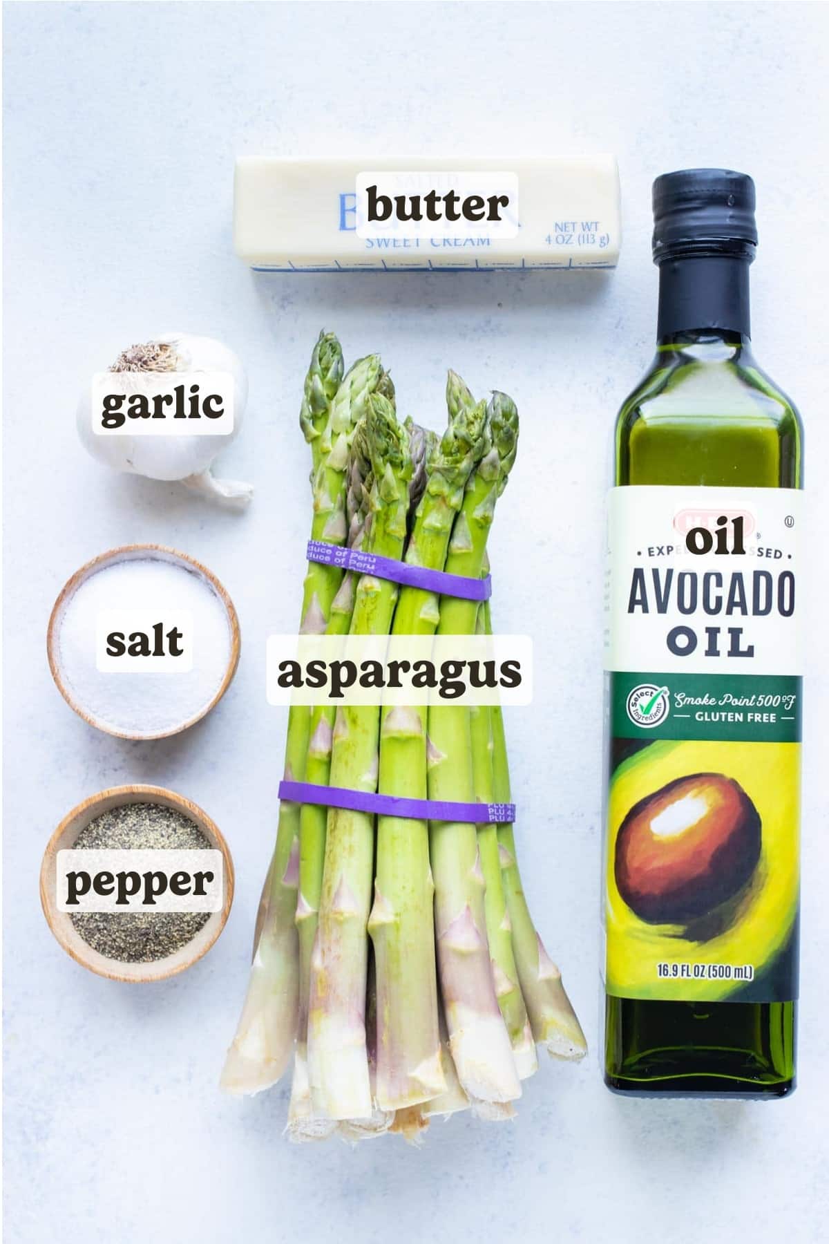 Avocado oil, asparagus, garlic, salt, pepper, and butter are the ingredients in this air fryer asparagus recipe.