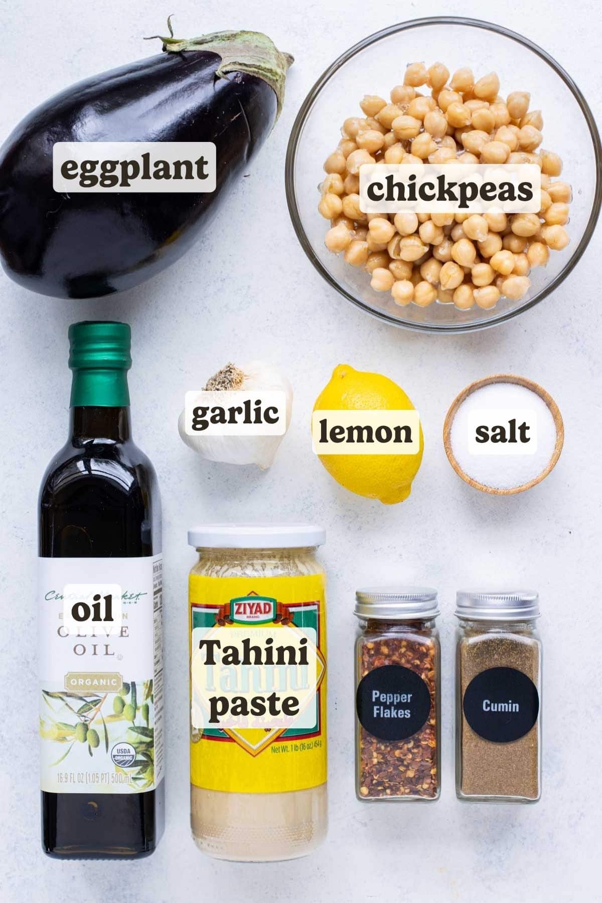 Eggplant, olive oil, tahini, seasonings, and lemon are the ingredients for this baba ganoush recipe.