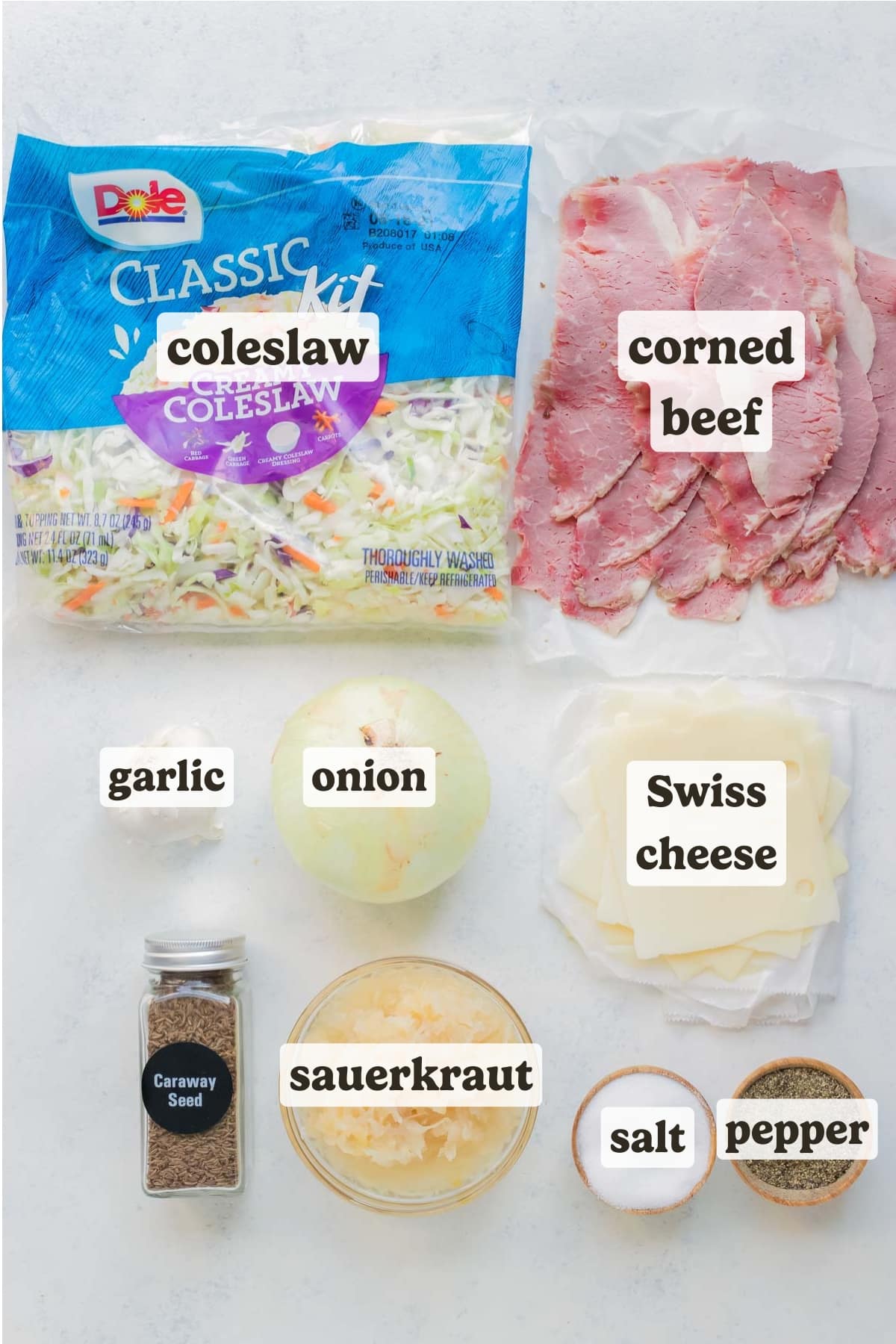 Cabbage, onions, corned beef, Swiss cheese, sauerkraut, are the ingredients in this Reuben in a bowl recipe.