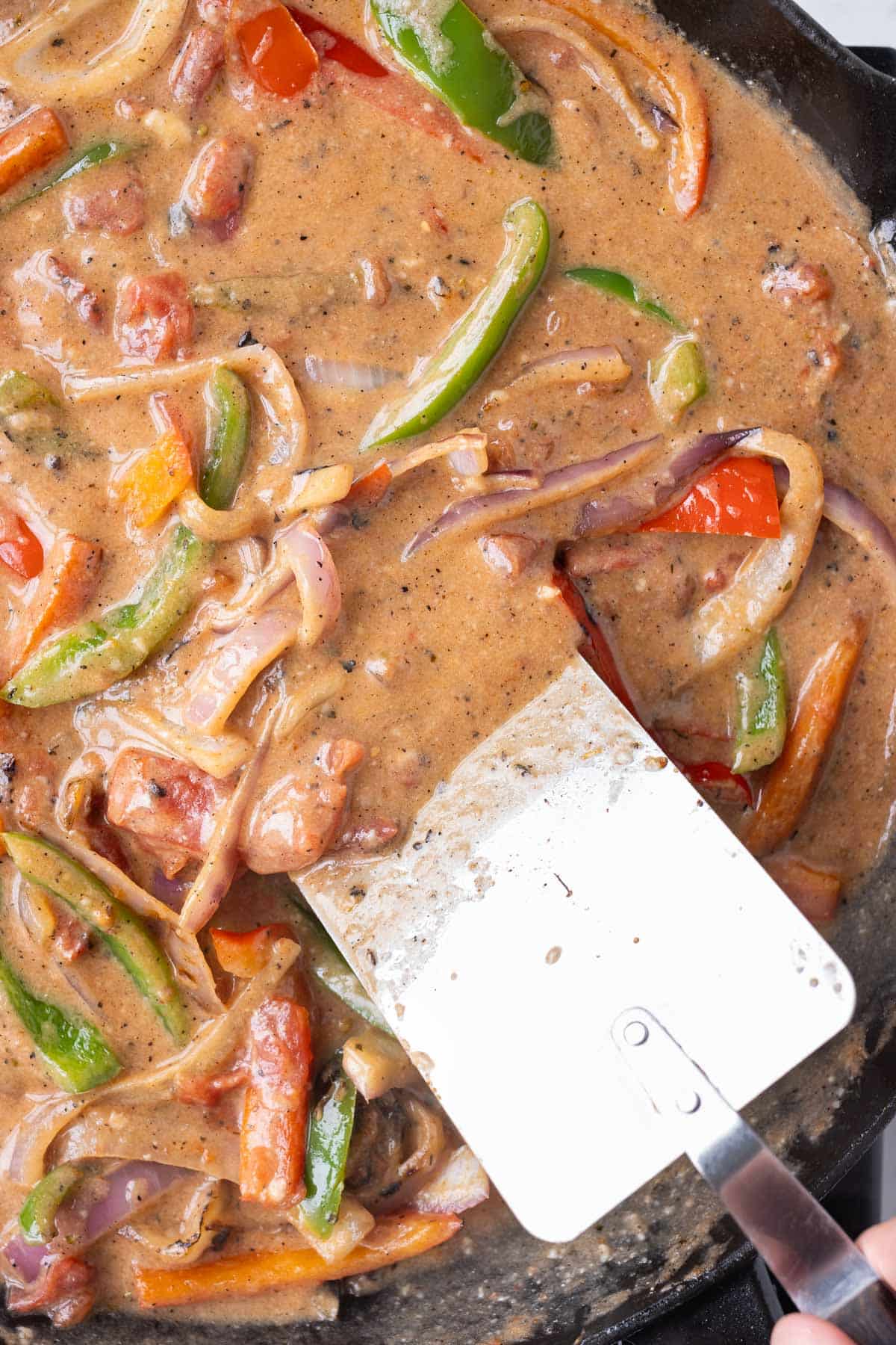 A creamy sauce is made in the skillet with the cooked veggies.
